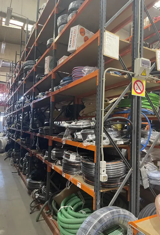 Aisle of hose coils on shelving